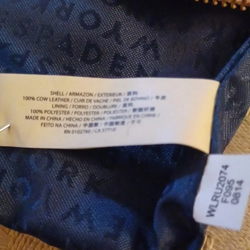 Kate Spade New York Pink Tone Wristlet.